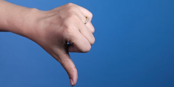 thumbs down on a blue background