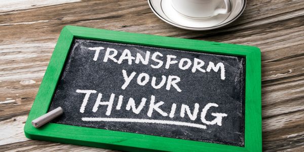 Transform your thinking hand written on a blackboard